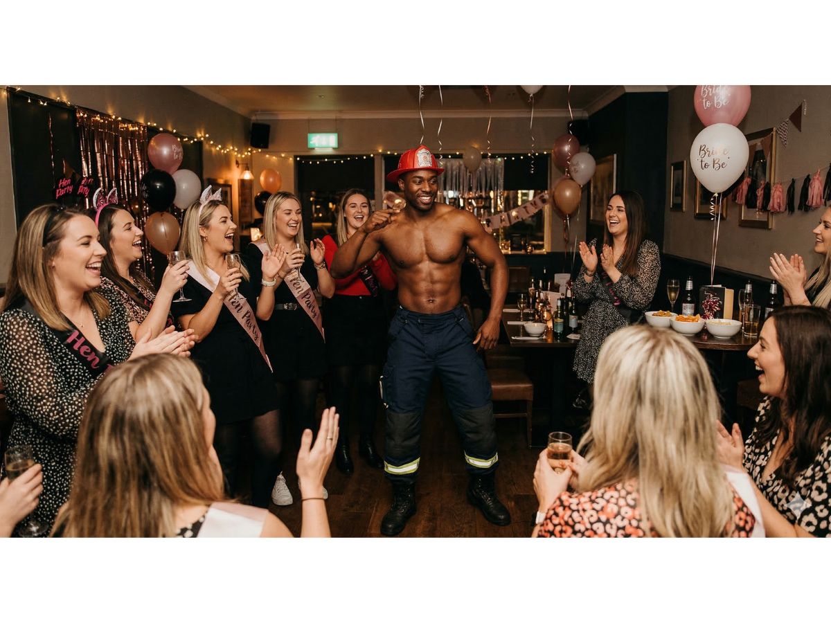 A Male stripper dressed as a fireman for a hen party event in Newport, South Wales